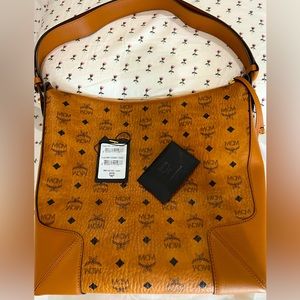 Authentic MCM Klara visetos hobo bag in size large . Bag strap is adjustable.